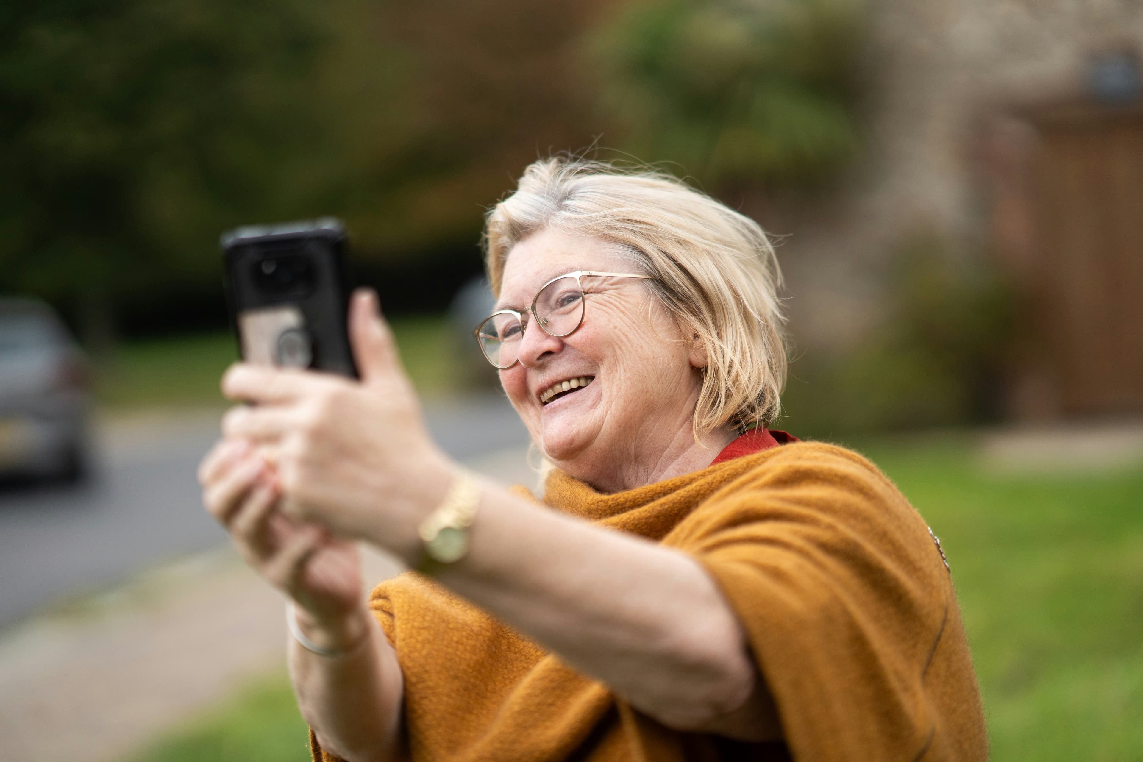 Senior on a video call with family using simple communication setup